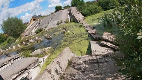 Blown up bridge over the river Strizhen, Chernihiv, Ukraine 스톡 동영상 249333914