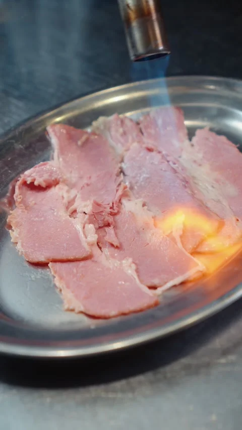 Blowtorch Searing Thin Meat Slices for Food Preparation Stock Footage 341404235