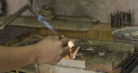 Blowtorch side view using twizzers Stock Footage 141365584