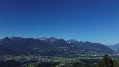 Bludenz, Austria - 08/11/2024: Paraglider fly through Mountain Landscape Video stock 282426429
