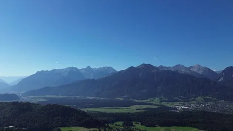 Bludenz, Austria - 08/11/2024: Paraglider fly above Mountain Landscape in Video stock 282426434