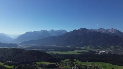 Bludenz, Austria - 08/11/2024: Paraglider fly above Mountain Range and Video stock 282426447