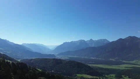 Bludenz, Austria - 08/11/2024: Paraglider fly above Mountain Range of Video stock 282426456