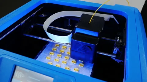 Blue 3D printer prints details for a 3D printer. Self-reproducing robots. Matrix Stock Footage 151496162