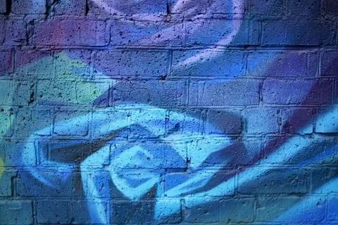 Blue abstract background on a brick wall, street art Stock Photos