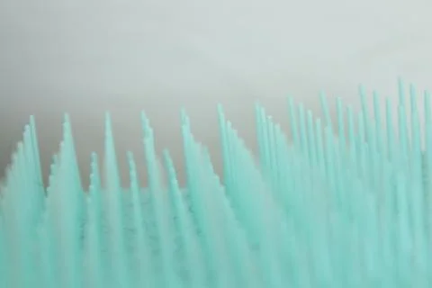 Blue abstract background created by upside down comb on white background Stock Photos