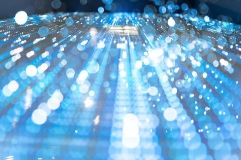 Blue abstract background of an electronic board with bokeh lights Stock Photos