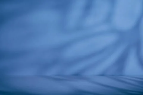 Blue abstract background with large blurred curved shadows and empty surfac.. Stock Photos