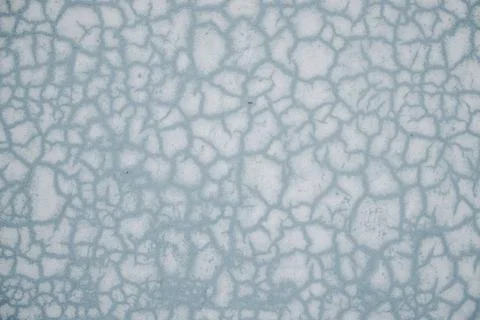 Blue abstract pattern texture background with cracks and holes. Close up. Stock Photos