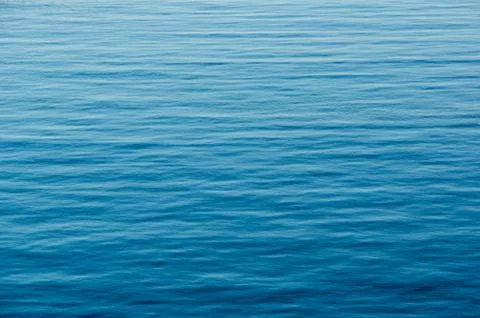 Blue abstract water surface with small waves Fotos Stock