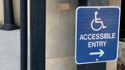 Blue Accessible Entry Sign Vídeos de archivo 134734018