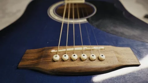Blue Acoustic Guitar Strings Over Wooden Bridge Stock Footage 325802618