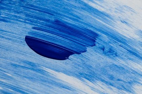 A blue acrylic brushstroke on a light background with pronounced texture an.. Stock Illustration