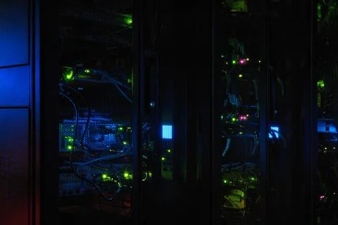 The blue AI intelligence system in the server room is constantly evolving. Th Stock Photos