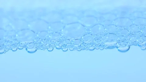 Blue air bubbles background. Liquid bubbles, cosmetic essence. Macro Stock Footage 275891325