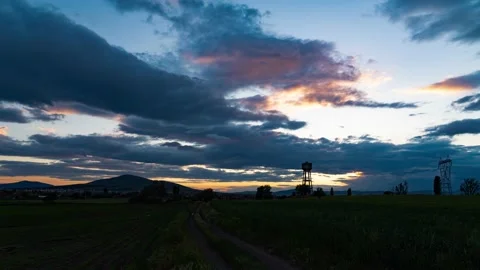 Blue and black clouds move at sunset Stock Footage 132039952