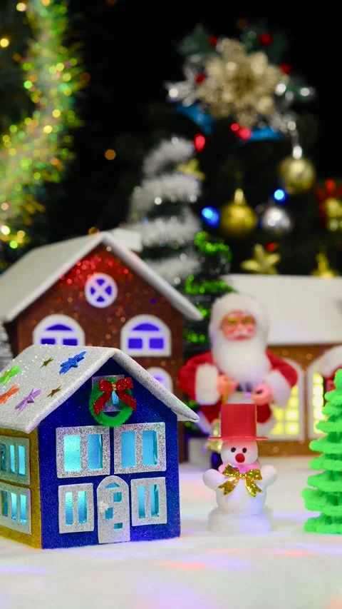 Blue and brown house surrounded by snowman and fir trees with Santa Claus Stock Footage 292923728