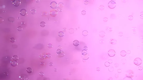 Blue and clear soap bubbles on pink, background Stock Footage 53019436