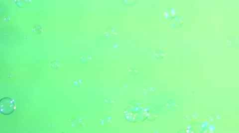 Blue and clear soap bubbles on light green, background 動画素材 53019751