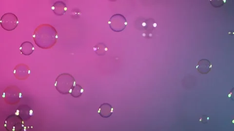 Blue and clear soap bubbles on pink and violet, background Stock Footage 53019868