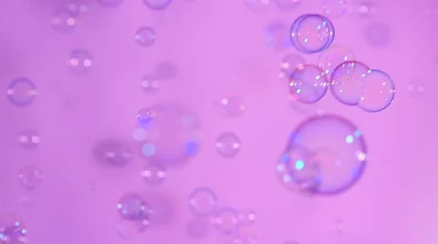 Blue and clear soap bubbles on pink, background, slow motion Stock Footage 53021931