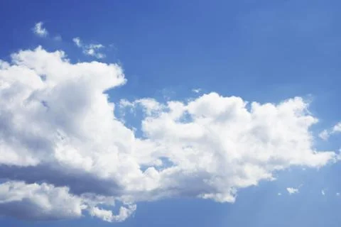 Blue and cloudy sky background Stock Photos