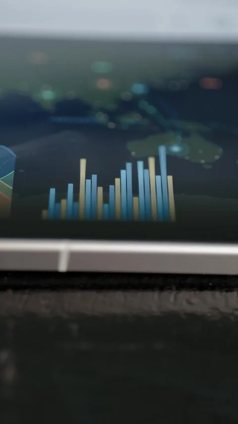 Blue and gold vertical bars rise across a dim world map Stock Footage 342486996