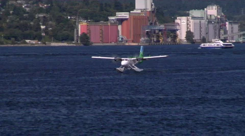 Blue And Green Float Plane Lands Stock-Footage 828703