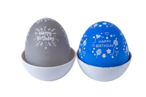 Blue and grey egg shaped kitchen timers isolated on a white background Stock Photos
