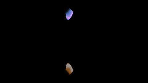 A Blue and Orange Flame Cross Each Other Against a Black Background Video stock 270304532