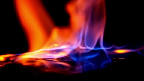 Blue and orange flames burning on dark reflective surface Stock Footage 332280752