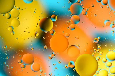 Blue and orange spots with multi-colored circles similar to the galaxy and .. Stock Photos