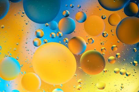 Blue and orange spots with multi-colored circles similar to the galaxy and .. Stock Photos