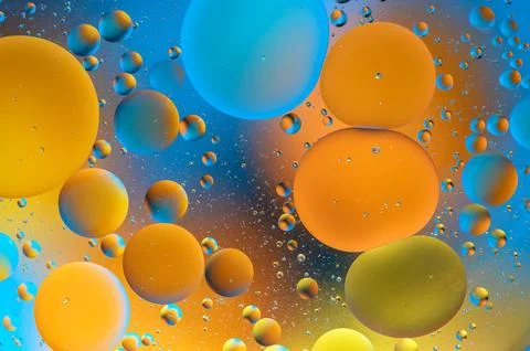 Blue and orange spots with multi-colored circles similar to the galaxy and .. Stock Photos