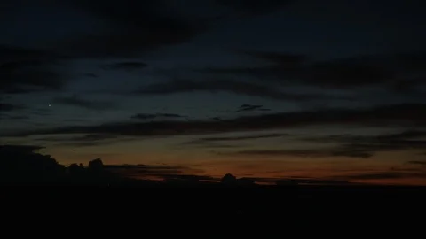 Blue and orange sunset with clouds and one bright star Video stock 98041306