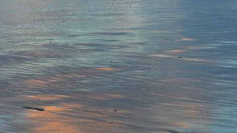 Blue and orange wet flat beach sand background Vídeo Stock 100495442