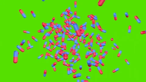 Blue and pink capsules explode and fly apart on green screen. Stock Footage 278182933