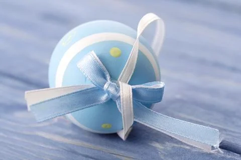 Blue and pink easter egg on blue background Stock Photos