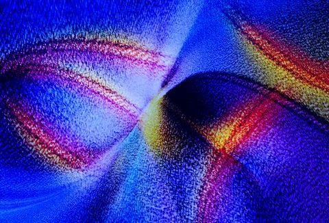 Blue and red abstract fold and grainy texture creating a sense of movement,.. Foto stock