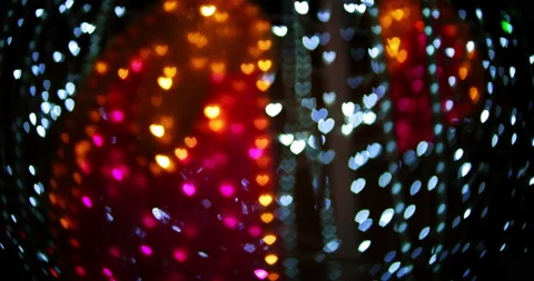 Blue and red blurred LED hearts bokeh glow in the dark Vídeos de archivo 231578193