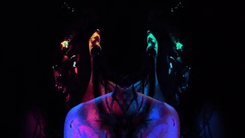 Blue and red double imaged effect of person smearing blood on themselves Stock Footage 99383222