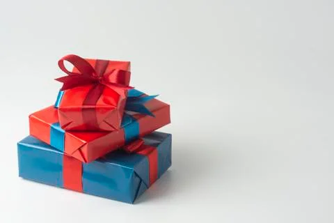 Blue and red gift boxes isolated over white background. Christmas, party or b Stock Photos
