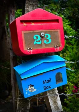 Blue and red mail boxes Stock Photos