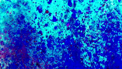 Blue and red paint drops in oil. Bubbles floating in space and slowly falling Stock Footage 149275181