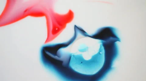 Blue and red paint interacting Stock Footage 61496323