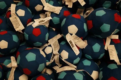 Blue and red patch soft soccer balls displayed in a toy bin at IKEA. Soft and Stock Photos