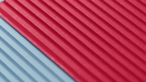 Blue and red ribbed paper close-up. Macro shooting of cardboard textured Stock Footage 169237340