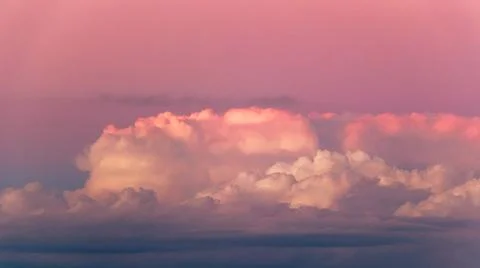 Blue and red sky with soft pink colorful clouds at the sunset background Stock Photos