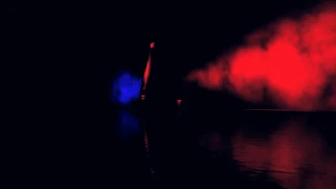 Blue and Red Spinning Beacon or Siren Light in Fog Stock Footage