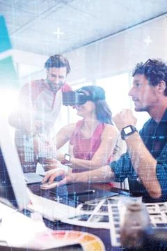 Blue and red technology interface against colleagues using technology Stock Photos